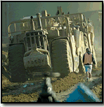 Workers by construction equipment